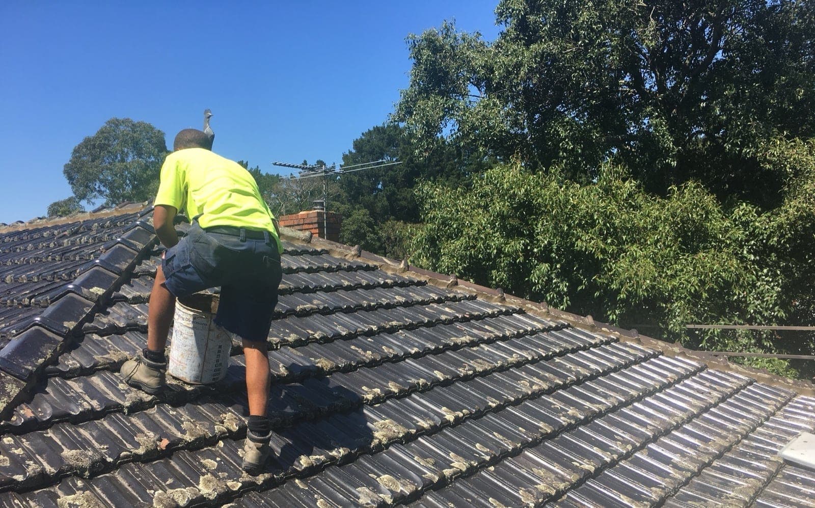 Professional roofers working on a roof